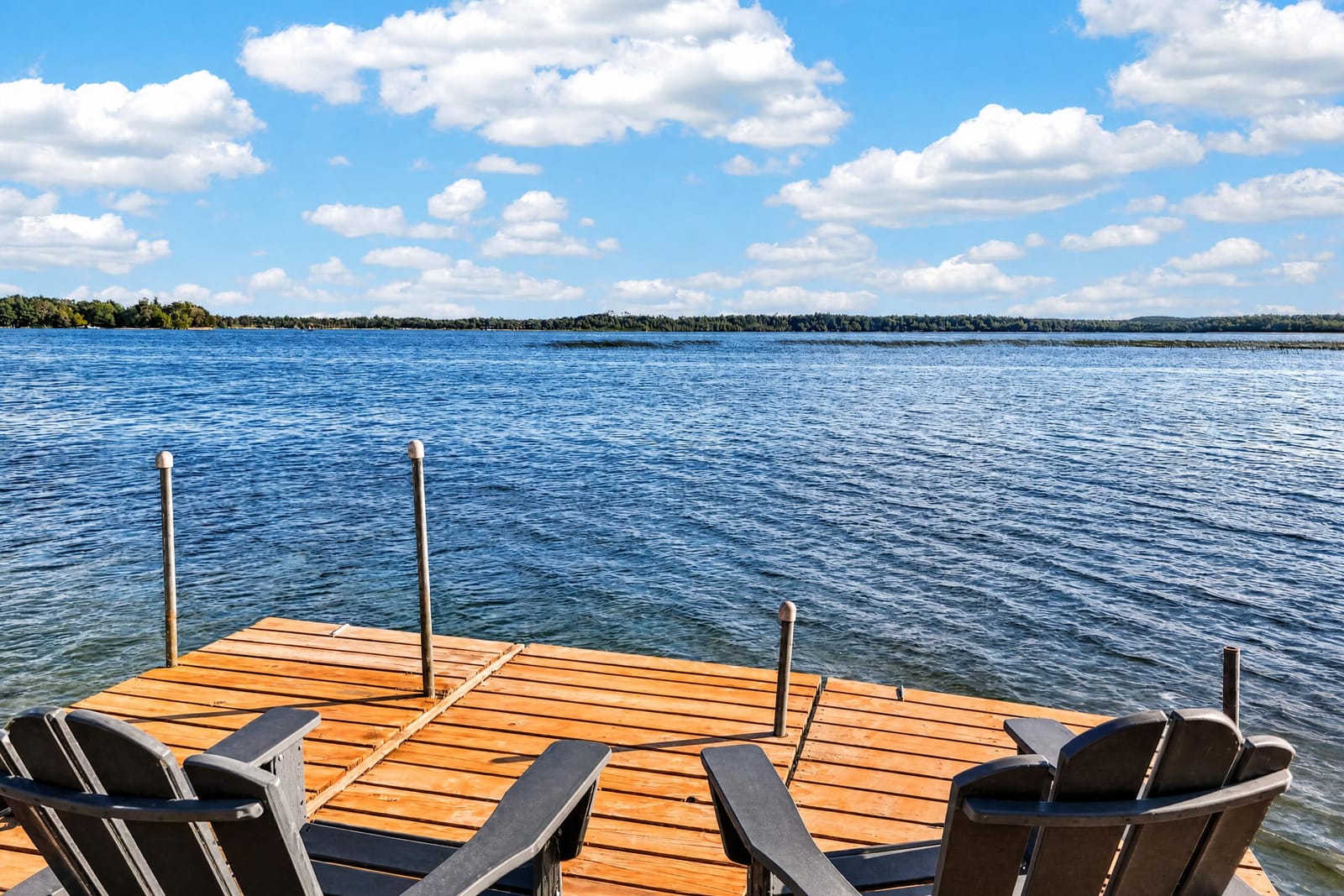 Chairs at the end of the dock in the afternoon.