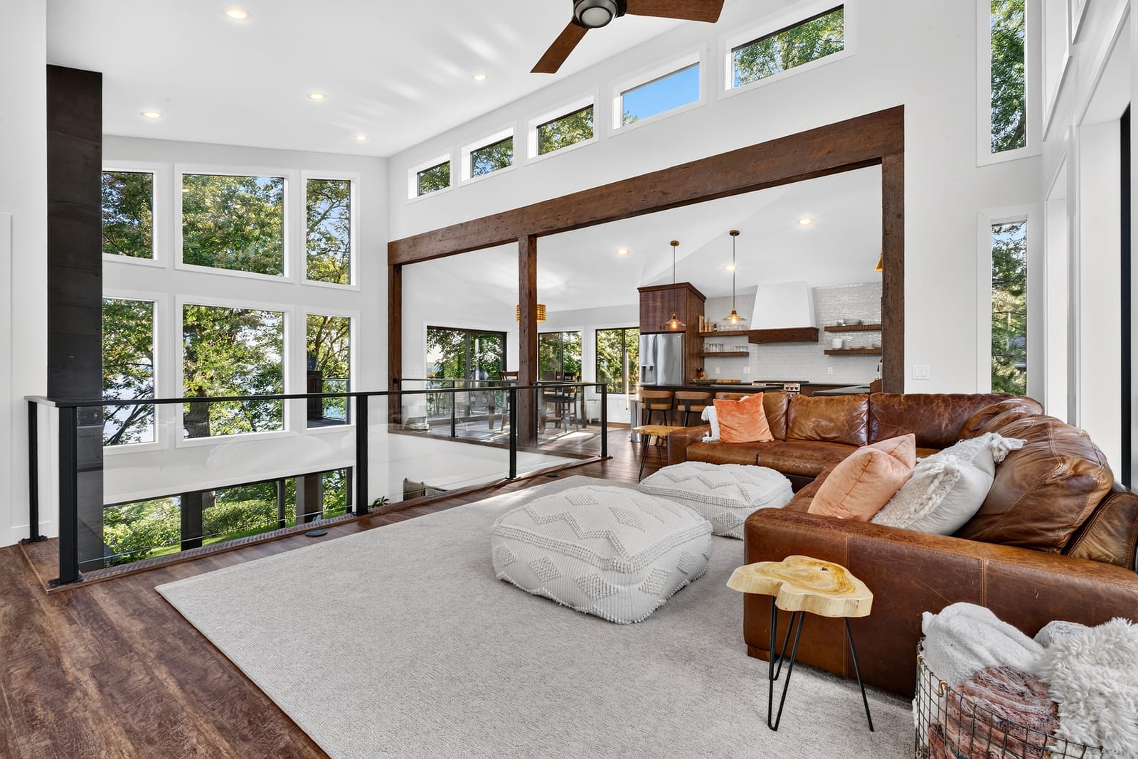 The upper living room, opening onto the double-height glass.