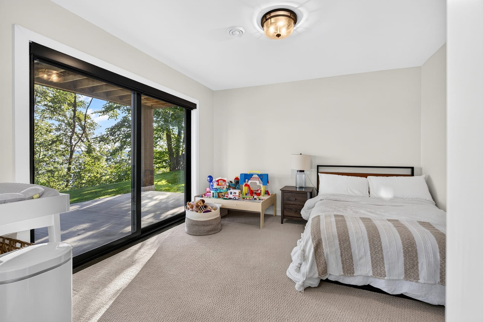 A bedroom with sliding doors straight onto the deck.