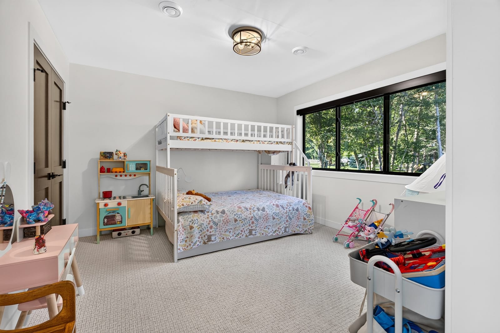 The bunk room, with a window onto the trees.